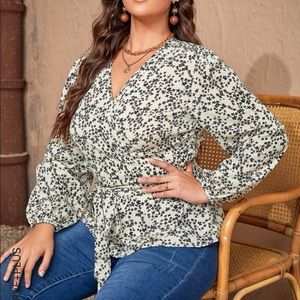 White and floral peplum wrap blouse.